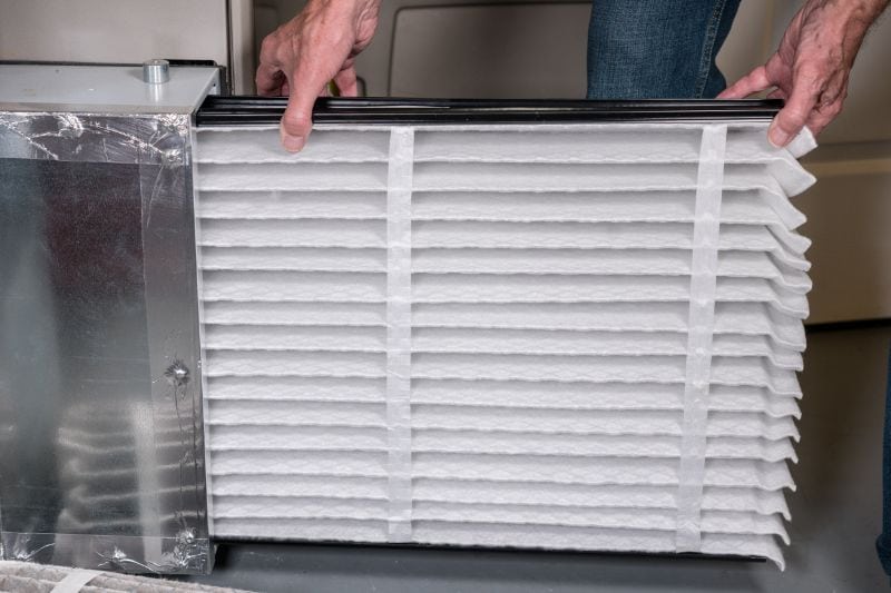 Replace Your Air Filter - Technician Changing HVAC Air Filter.