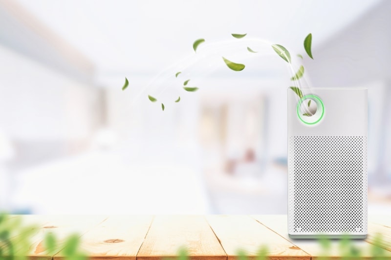 What Do Air Purifiers and Air Filters Do? Air purifier a living room, air cleaner removing fine dust in house. protect PM 2.5 dust and air pollution concept.